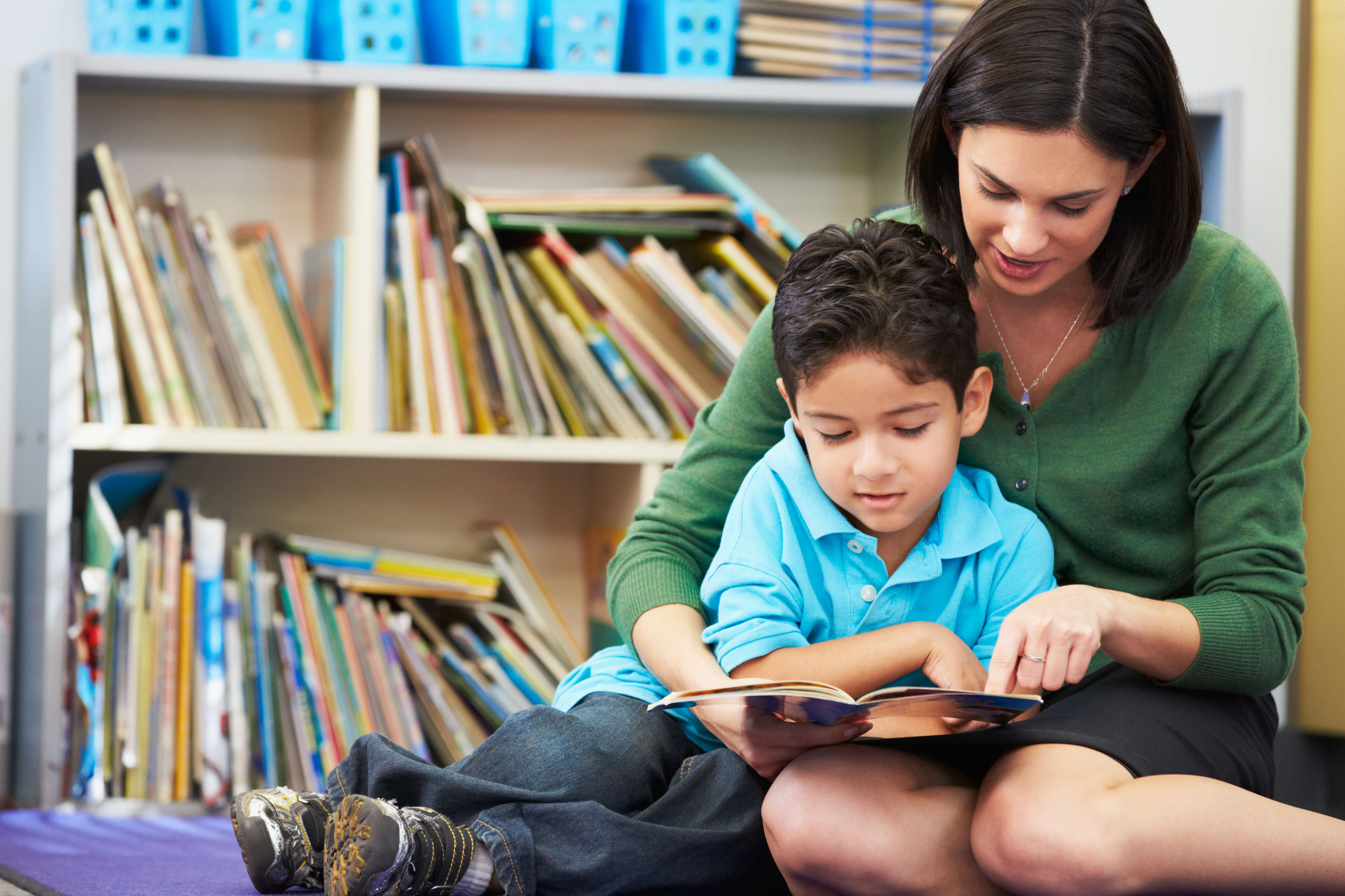 Woman and boy reading a book Woman and boy reading a book
