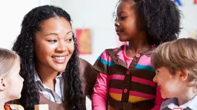 Preschool children in classroom with teacher
