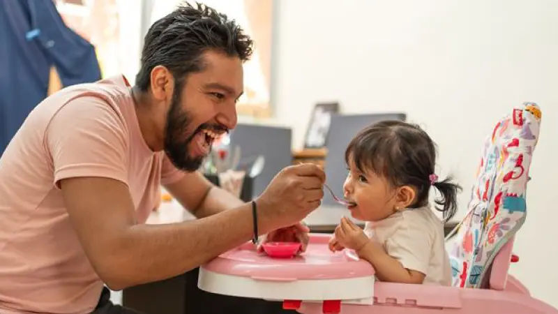 Father with child at mealtime