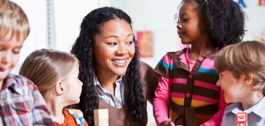 Preschool children in classroom with teacher