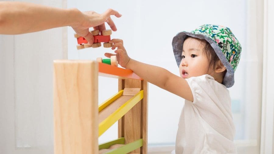 toddler playing with toys