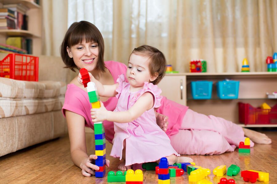 Mother and daughter with building blocks