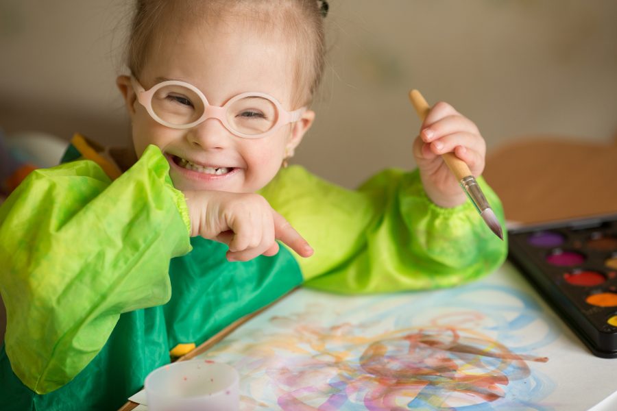Smiling Girl with a Painting Girl smiling with her painting