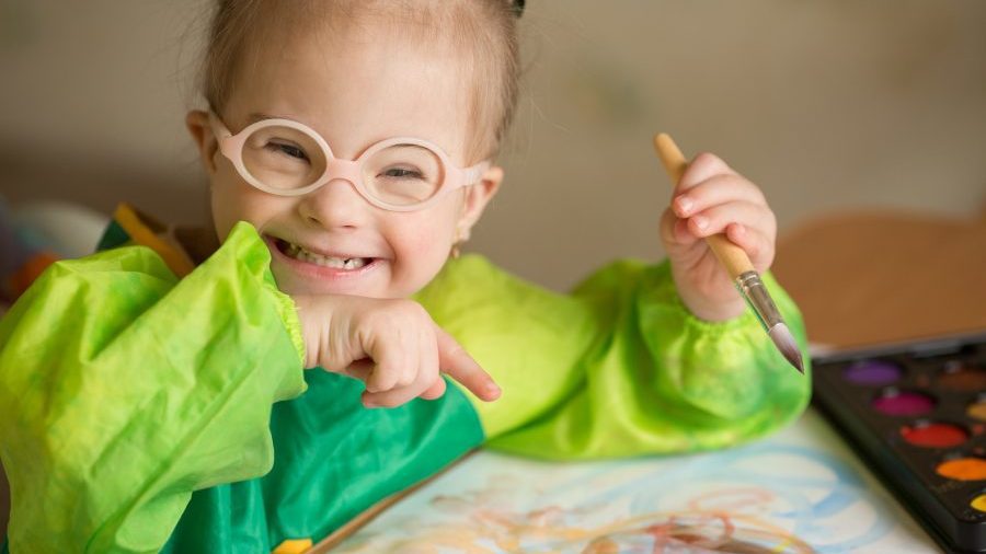 Girl smiling with her painting