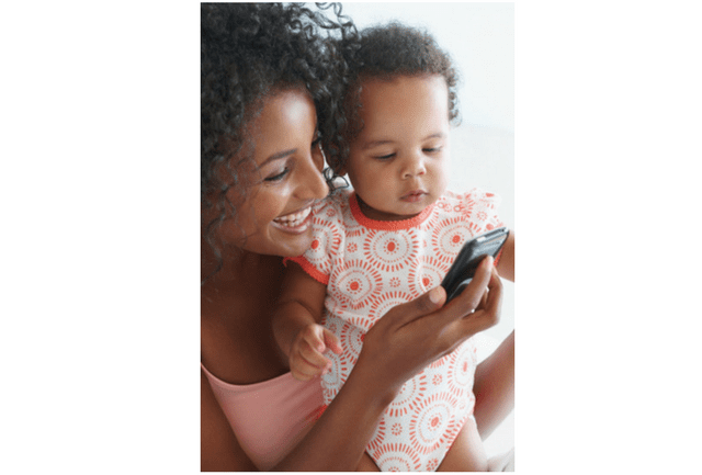 Mom and baby talking on cell phone