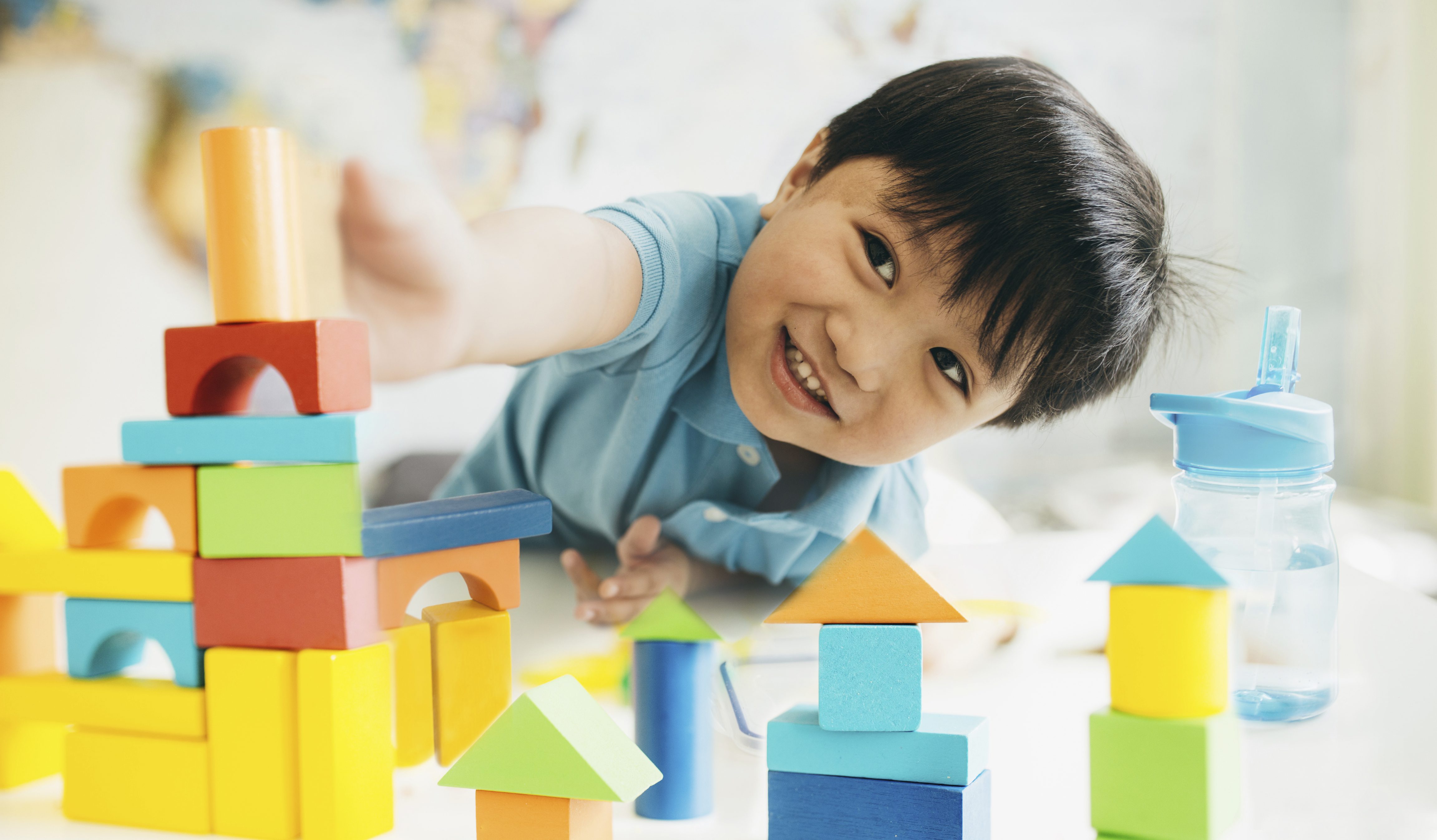 Creating new cities child playing with blocks