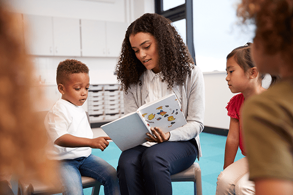 students and teacher reading website