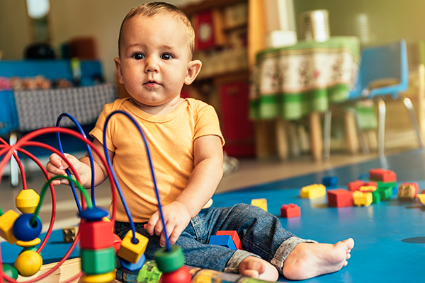 happy-baby-playing-with-toy-blocks-XLQ78QH