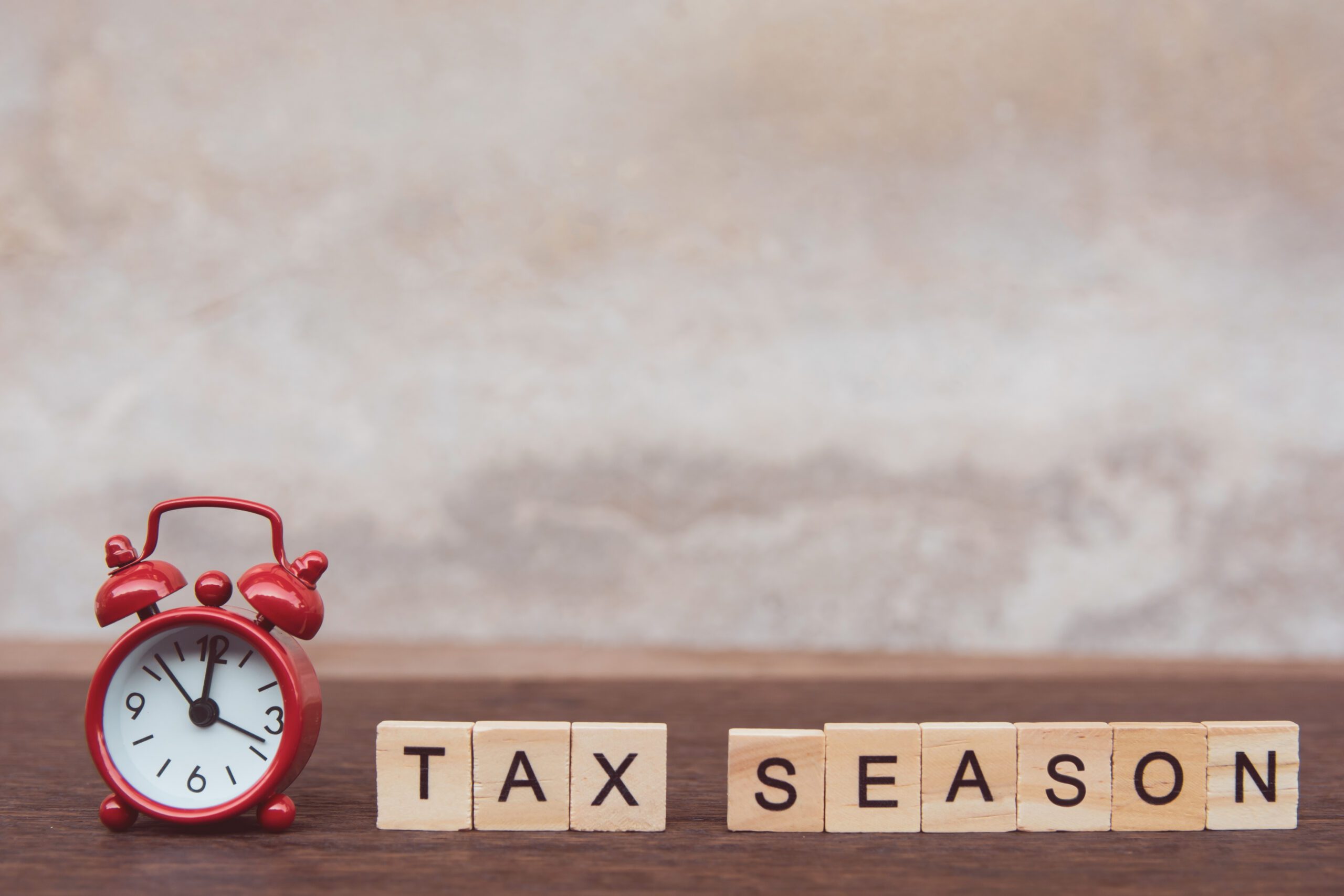 Tax,Season,With,Wooden,Alphabet,Blocks,And,Red,Alarm,Clock,
